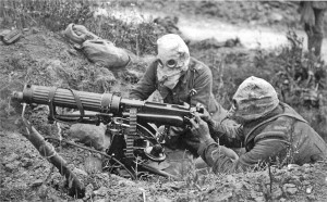 A British Vickers machine gun unit, wearing gas masks, the Battle of the Somme, 1916